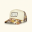 DECOY Hunt Camp Trucker Hat FrogSkin camo bill with beige front and DECOY patch on cream background
