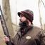 Duck hunter wearing Olive Jeep Cap outdoors, showcasing vintage military-inspired style and functional design in the field.